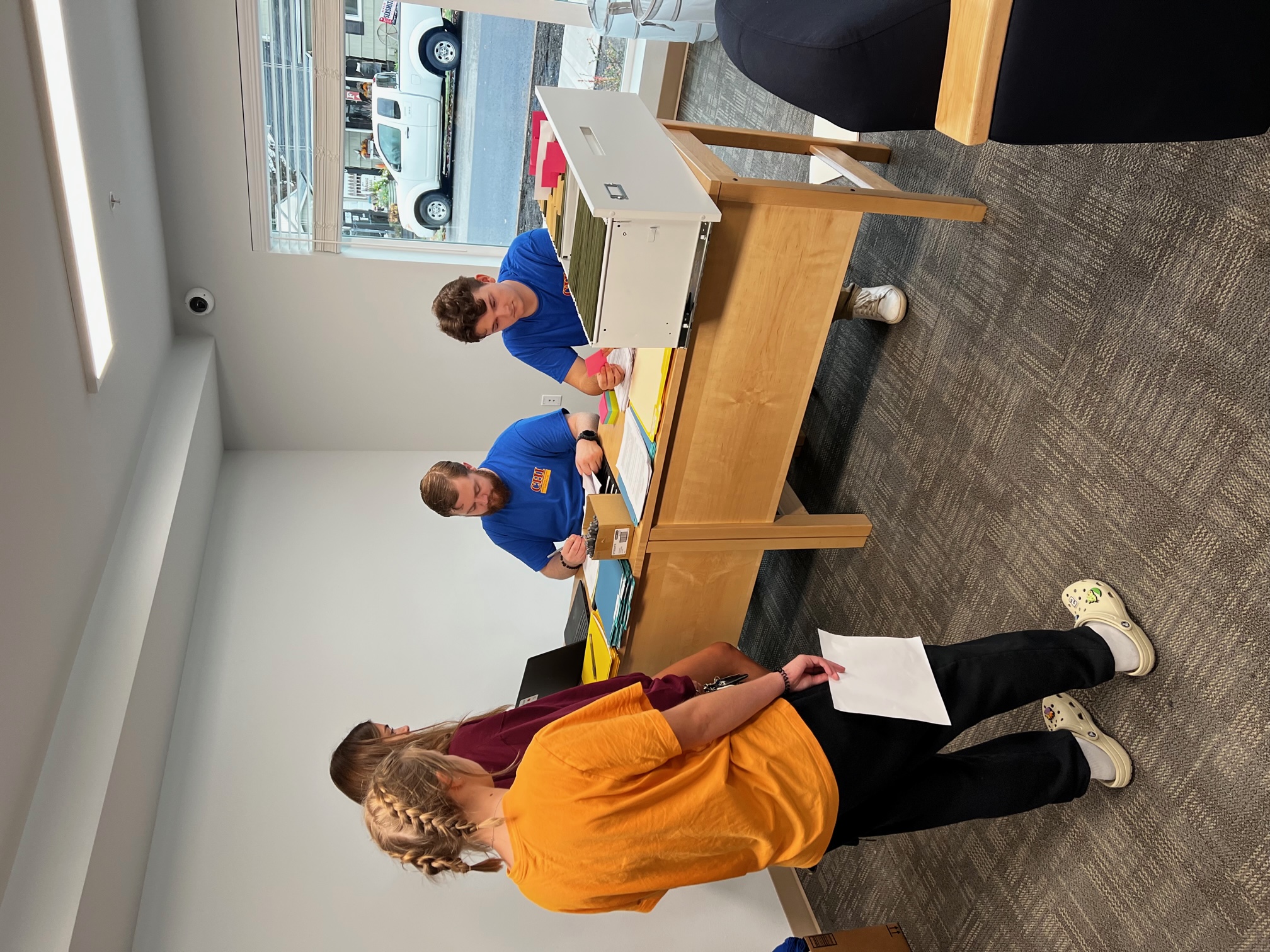 Isaac and Levi registering new residents to move in.