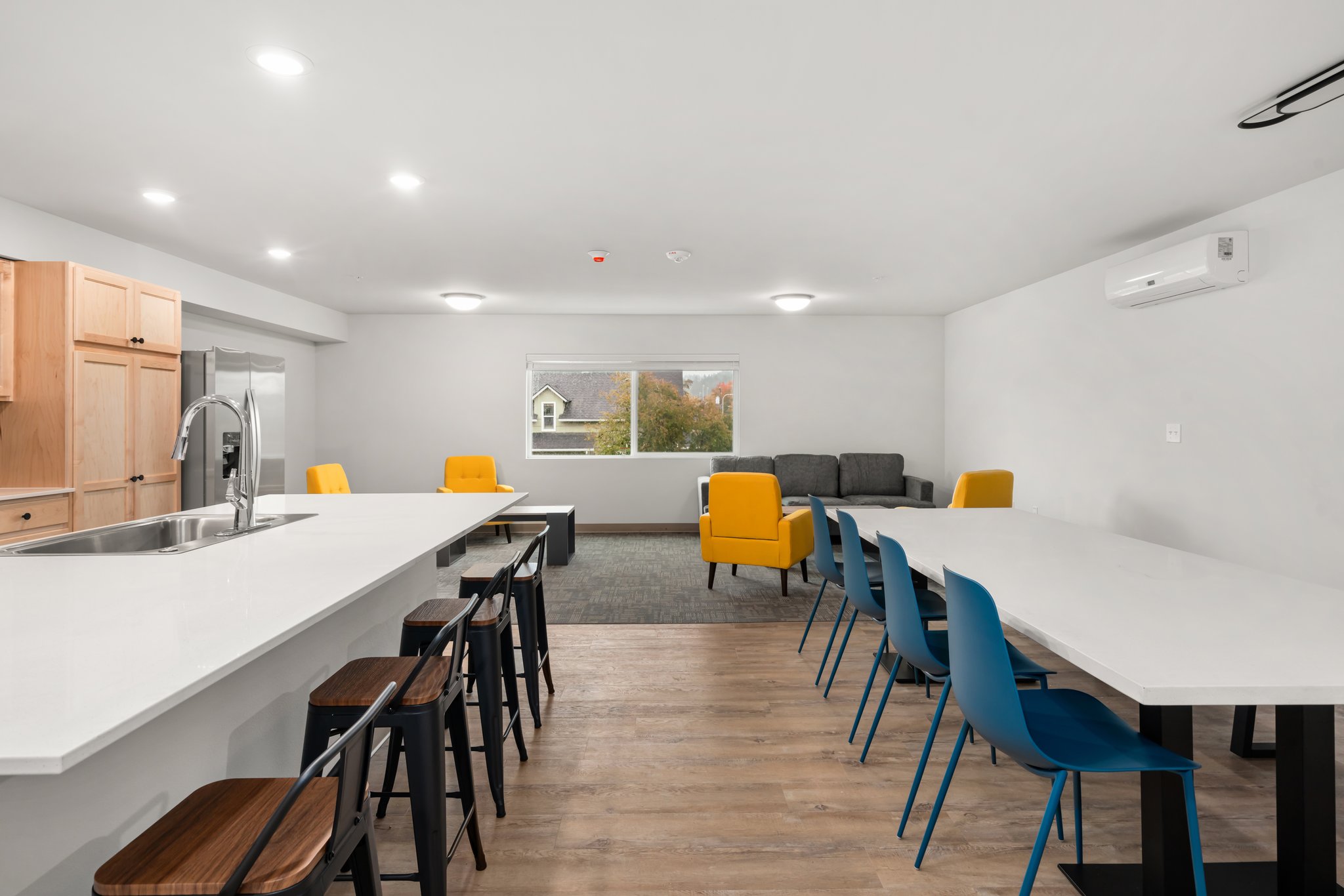 View of dining area and sitting area.